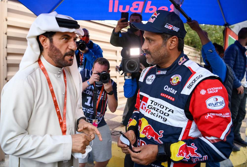 resident of the International Automobile Federation (FIA) Mohammed ben Sulayem (R) greets Toyota's driver Nasser Al-Attiyah of Qatar at the end of the Stage 1A of the Dakar Rally. (AFP)