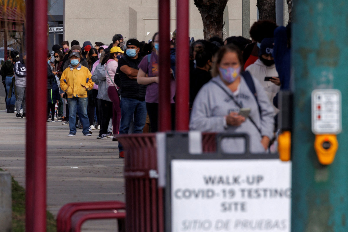 People wait outside a community center in San Diego, California, on Jan. 10, 2022 as long lines continue for individuals trying to be tested for COVID-19. (REUTERS/Mike Blake)