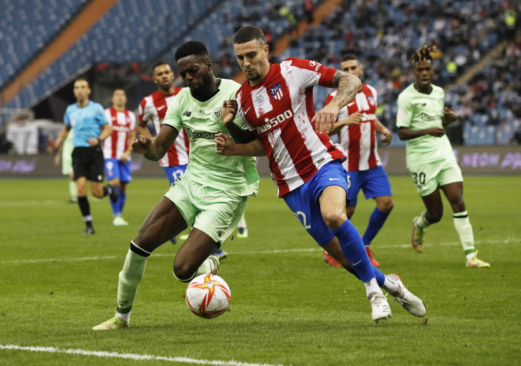 Athletic Bilbao’s Inaki Williams in action with Atletico Madrid’s Mario Hermoso during their Spanish Super Cup Semi Final match at King Fahd International Stadium in Riyadh on Thursday. (Reuters)