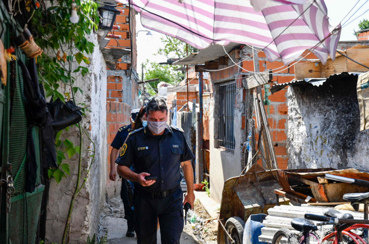 Police are seen during a raid in Taller Puerta 8 shantytown, Buenos Aires province, on Feb. 2, 2022. (AFP PHOTO / TELAM / Eliana Obregon)
