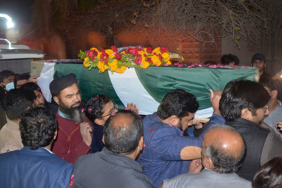 Relatives carry the coffin of a young Pakistani military officer who was killed during attacks by militants on a security camp in Naushki district of Balochistan province on Feb. 3, 2022. (Photo by Ghazanfar Majid / AFP)