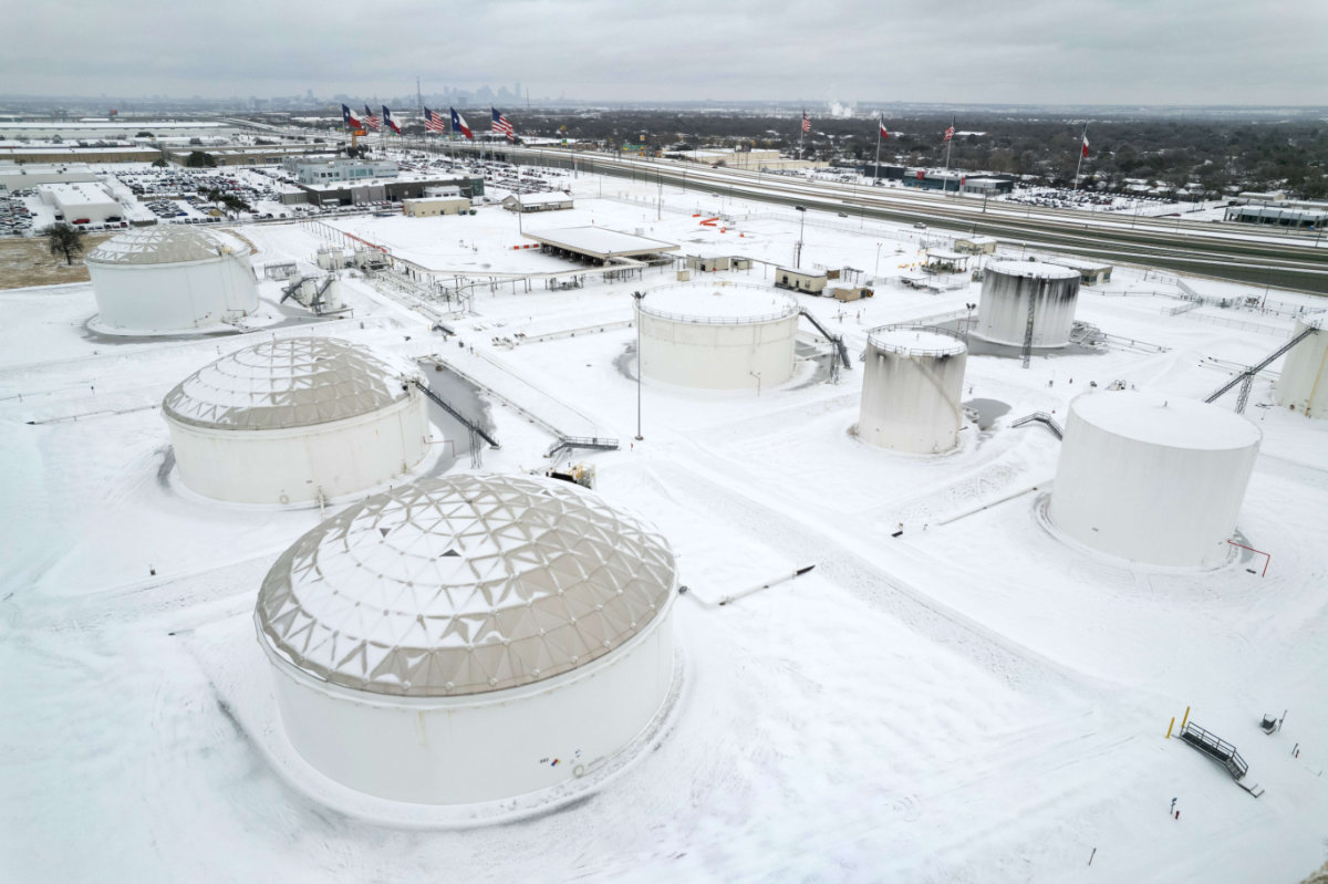 Fuel tanks are covered in snow and ice at an Exxon Mobile Pipeline facility on Feb. 03, 2022 in Irving, Texas amid a winter storm sweeping the midwest and eastern US. (John Moore/Getty Images/AFP)