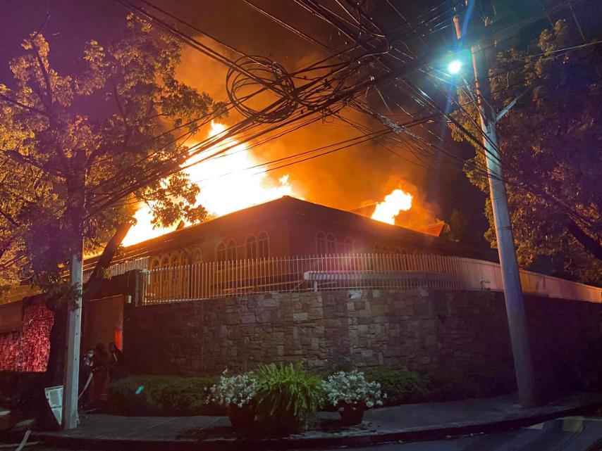 Philippine firefighters extinguish a fire that broke out at the Russian Embassy in Makati City, metropolitan Manila. (Supplied)