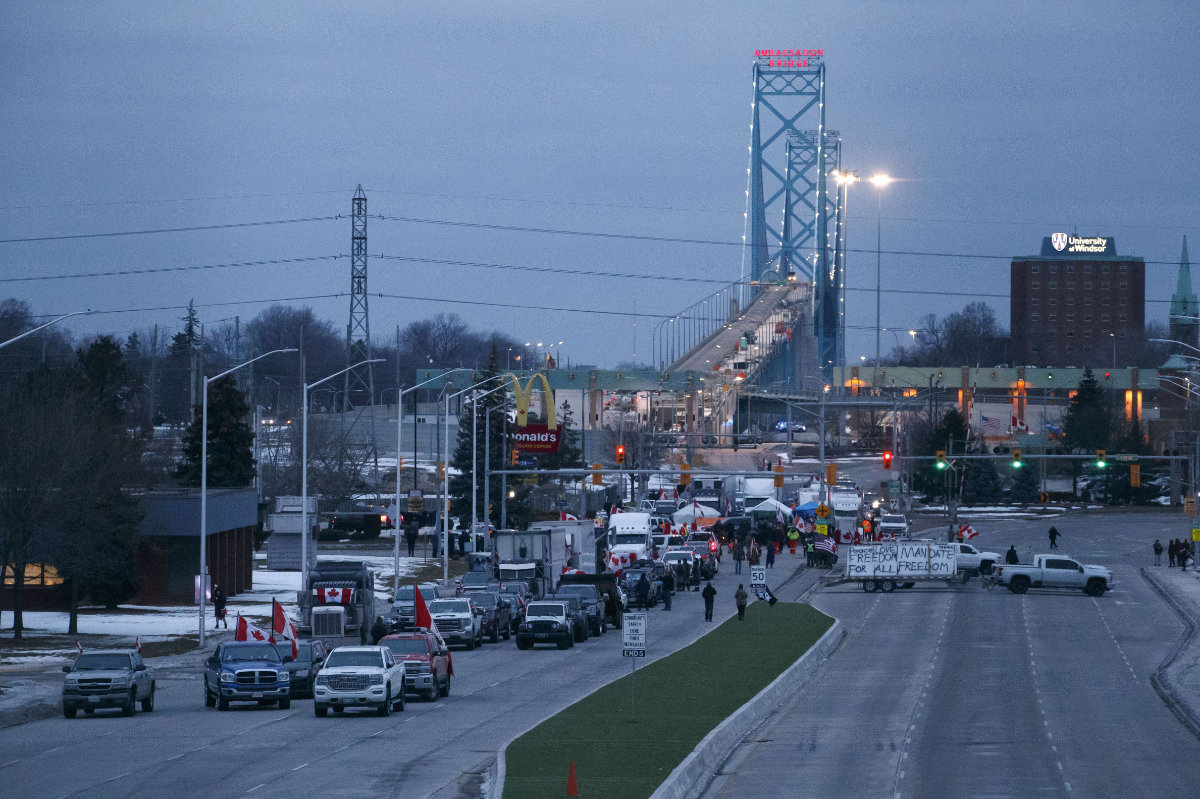 Protesters and supporters blockade the foot of the Ambassador Bridge connecting Windsor, Ontario, to Detroit, sealing off the flow of commercial traffic. (Cole Burston/Getty Images/AFP)