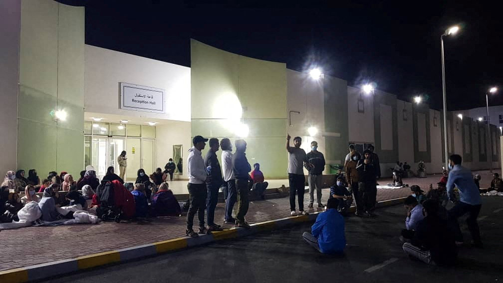 Afghans hold a rally at a Gulf facility in in Abu Dhabi, United Arab Emirates, to protest the lengthy US relocation process. (Rise to Peace/via REUTERS)