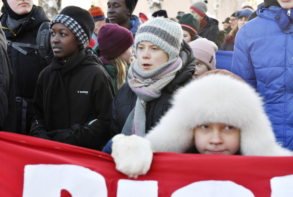 Swedish climate activist Greta Thunberg, center, takes part in a climate strike with Sami children in Jokkmokk, Sweden, Feb. 7, 2020. (AP)
