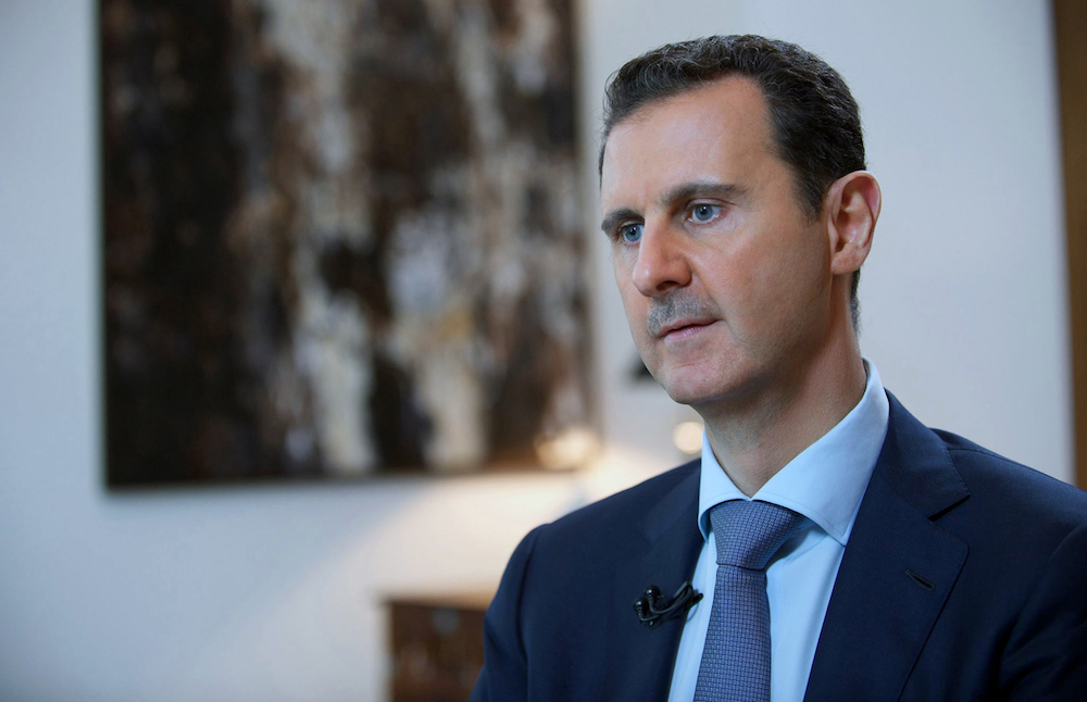 The regime of Syrian President Basher Assad has turned billions of dollars in foreign assistance, intended to alleviate the suffering of the Syrian people, into a lasting “profit center,” according to experts. (AP/File Photo)
