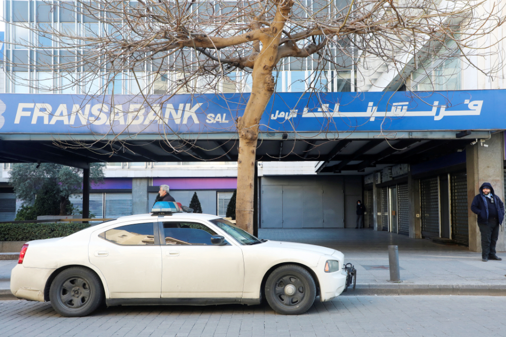 A police car is parked in front of a branch of Fransabank in Beirut, Lebanon March 16, 2022. (REUTERS)