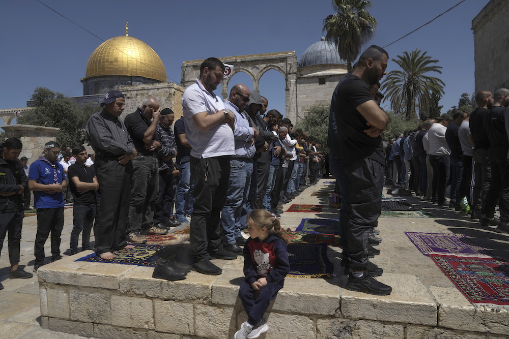 Palestinians clashed with Israeli police at the Al-Aqsa mosque compound in Jerusalem before dawn on Friday as thousands gathered for prayers during the holy month of Ramadan. (AP)