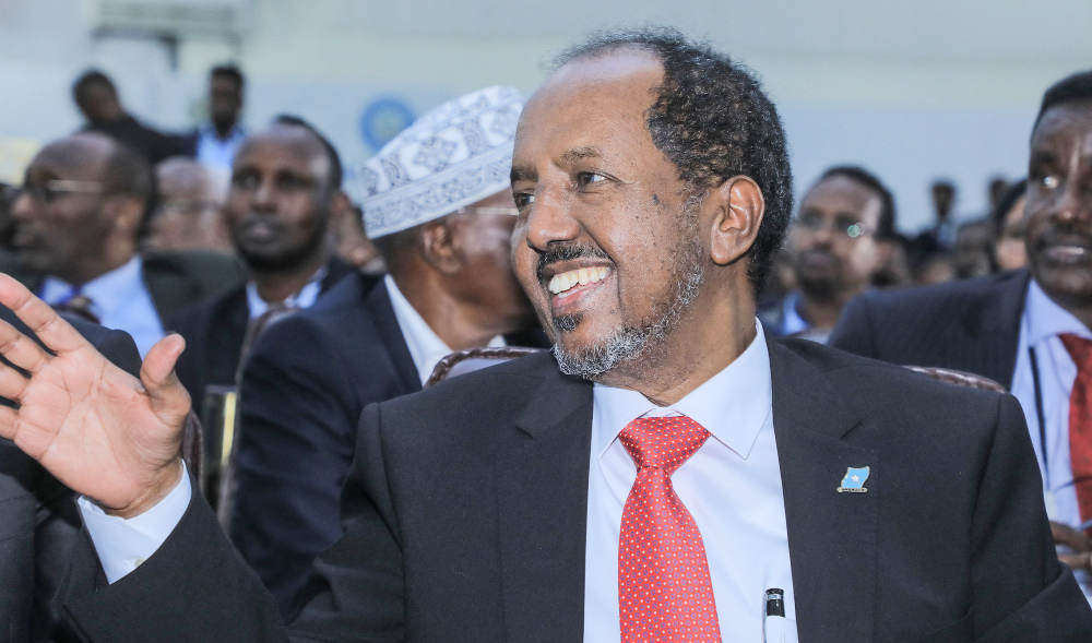Newly elected Somalia President Hassan Sheikh Mohamud waves after he was sworn-in, in the capital Mogadishu, on May 15, 2022. (AFP)