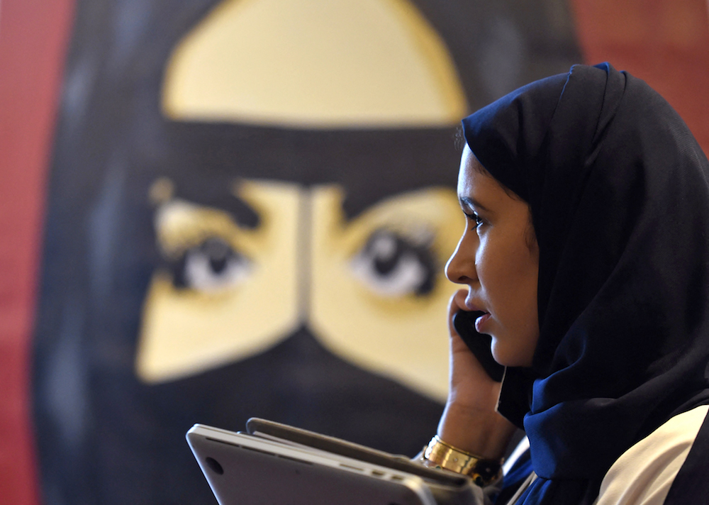 A Saudi woman talks on her phone during the "MiSK Global Forum" held under the slogan "Meeting the Challenge of Change" in Riyadh. (AFP)