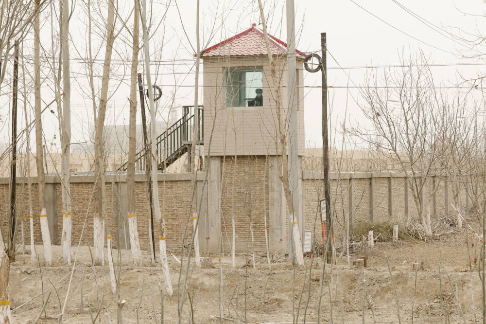 A security person watches from a guard tower around a detention facility in Yarkent County in northwestern China's Xinjiang Uyghur Autonomous Region on March 21, 2021. (AP)