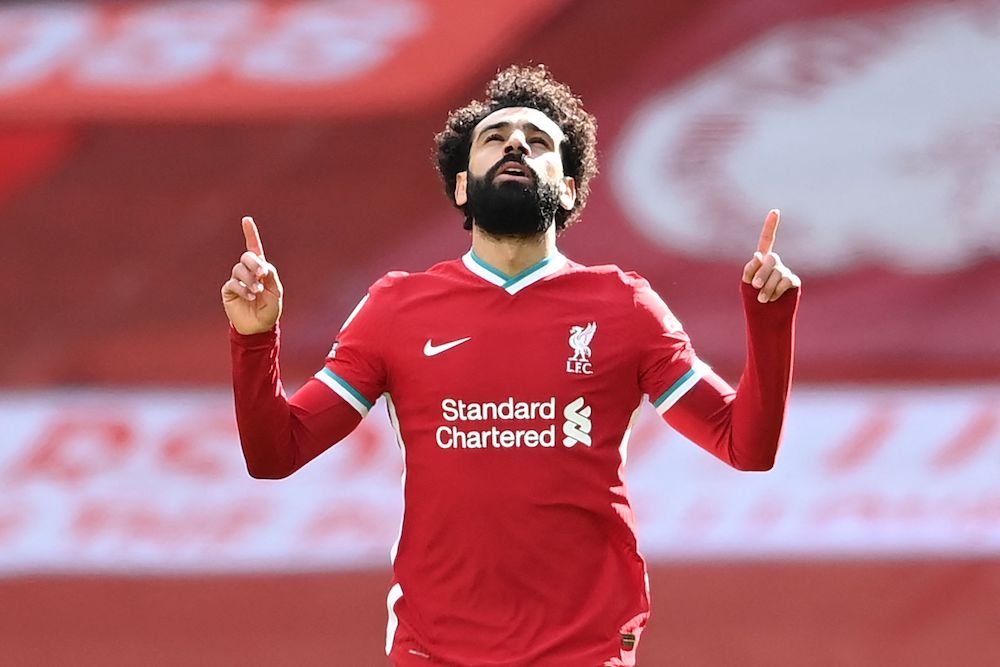 Mohamed Salah ended speculation over his future by signing a new contract with Liverpool on Friday that will reportedly run to 2025. (AFP)
