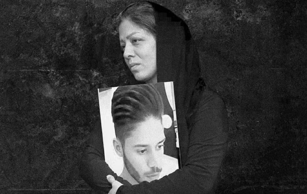 Mahboubeh Ramezani, mother of Pejman Gholipour, was detained earlier this month, convicted for protesting the killing of her son, and is being held in Evin prison. (Screenshot/Twitter)