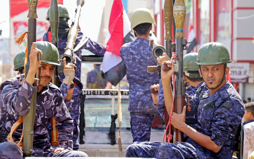 Yemeni security forces take part in a military parade marking the 56th anniversary of the 1962 revolution which established the Yemeni republic, in the third city of Taez on September 26, 2022. (AFP)