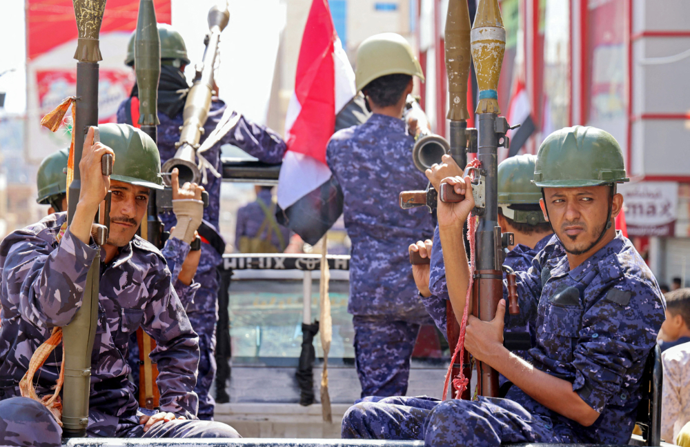 Yemeni security forces take part in a military parade marking the 56th anniversary of the 1962 revolution which established the Yemeni republic, in the third city of Taez on September 26, 2022. (AFP)