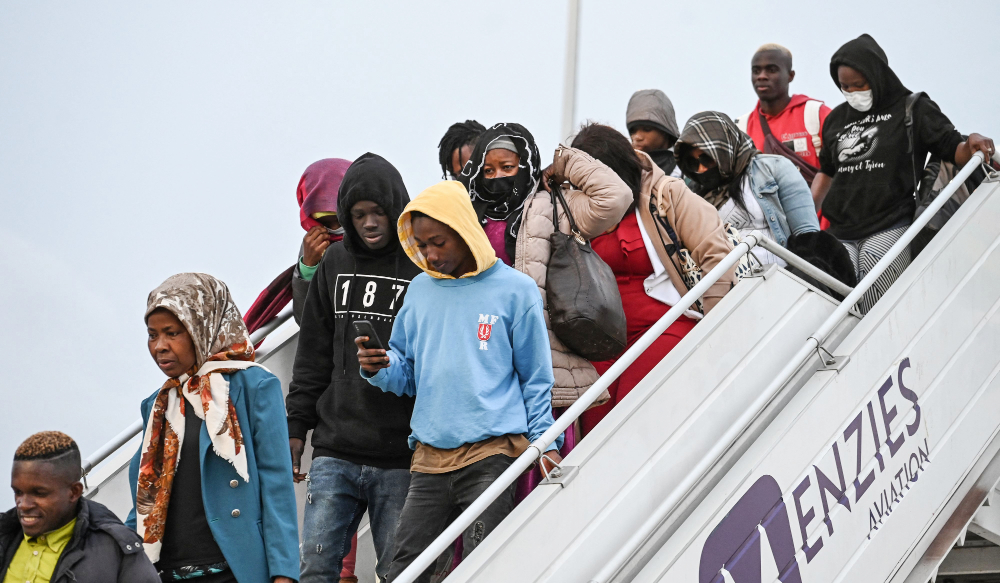 Ivorian migrants disembark a repatriation plane from Tunisia at Felix Houphouet Boigny airport in Abidjan, on March 04, 2023. (AFP)
