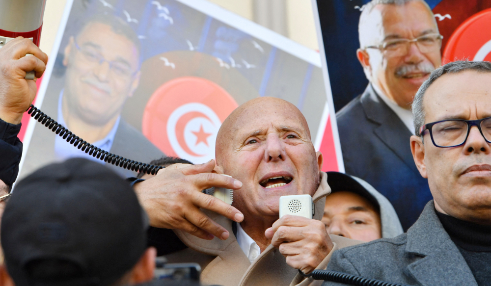 Ahmed Nejib Chebbi, political committee chief of Tunisia's Amal Party and leader of the opposition National Salvation Front part in a demonstration in Tunis on March 5, 2023, in defiance of a protest ban, demanding the release of prominent figures opposed to the president who were arrested in recent weeks. (AFP)