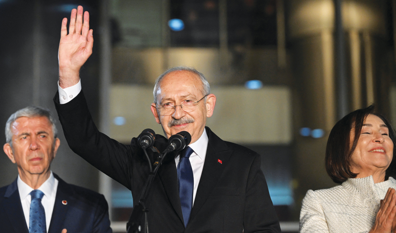 Turkiye’s main opposition Republican People’s Party leader Kemal Kilicdaroglu greets his supporters at the party’s headquarters after a six-party alliance announced him as its presidential candidate. (Reuters)