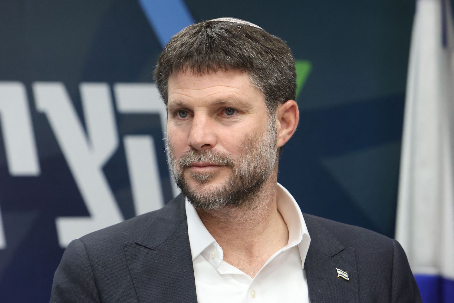 Israel's Finance Minister Bezalel Smotrich attends a meeting at the parliament, Knesset, in Jerusalem on March 20, 2023. (AFP) Israel's Finance Minister Bezalel Smotrich attends a meeting at the parliament, Knesset, in Jerusalem on March 20, 2023. (AFP)