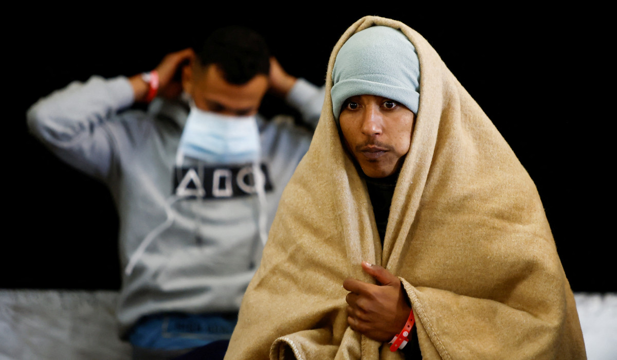 Migrants stand on the Geo Barents rescue ship, operated by Medecins Sans Frontieres (Doctors Without Borders), after being rescued from a wooden boat off the coast of Libya in the central Mediterranean Sea, March 24, 2023. (REUTERS) Migrants stand on the Geo Barents rescue ship, operated by Medecins Sans Frontieres (Doctors Without Borders), after being rescued from a wooden boat off the coast of Libya in the central Mediterranean Sea, March 24, 2023. (REUTERS)