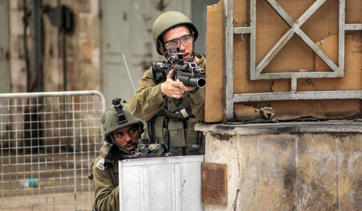 Israeli soldiers take aim during clashes in the centre of Hebron in the occupied West Bank on July 4, 2023. (AFP file photo)