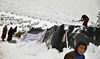 Storm blankets Syrian tented camps in snow, at least one child dead