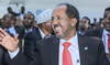 Newly elected Somalia President Hassan Sheikh Mohamud waves after he was sworn-in, in Mogadishu, on May 15, 2022. (AFP)