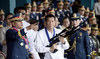Philippine President Rodrigo Duterte (C) holding a Galil sniper rifle in Manila. (AFP file photo)