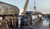 Bus rams into fuel truck in eastern Pakistan, killing 20