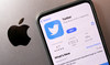 Smartphone with displayed Twitter app is seen placed on Apple logo in this illustration taken, November 29, 2022. (REUTERS)