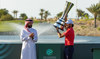 Golf Saudi CEO Noah Alireza hands Abraham Ancer the trophy. (Golf Saudi) 
