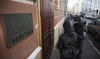 Russian police target Nobel Prize-winning group in mass raids