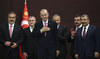 Turkish President Recep Tayyip Erdogan stands with the new cabinet members during the inauguration ceremony in Ankara. 