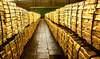 Gold slips as firm dollar counters bets for Fed pause