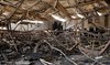 This image shows the devastated interior of Al-Haitham hall in Qaraqosh, also known as Hamdaniyah.