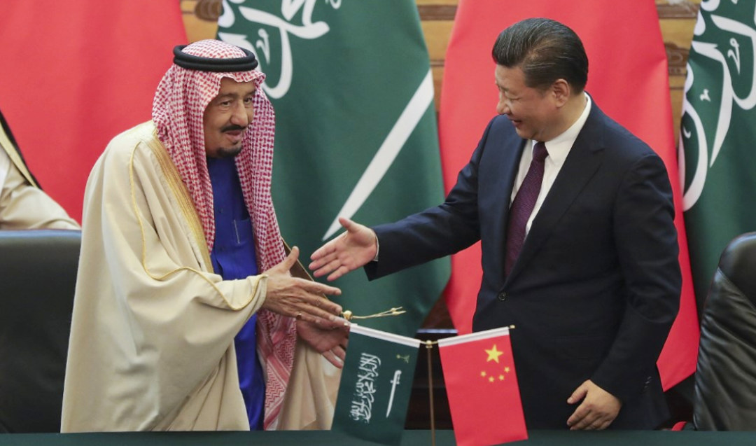 King Salman, President Xi Jinping shaking hands during a signing ceremony in Beijing in March 2017. (AFP file photo)