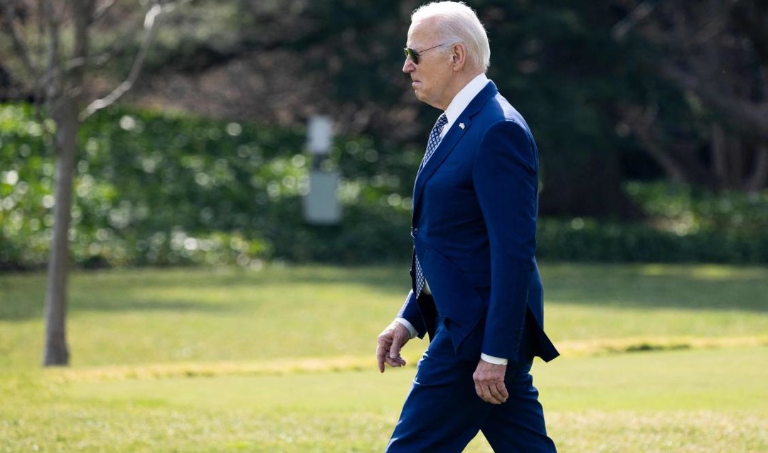 US President Joe Biden walks to Marine One. (AFP)