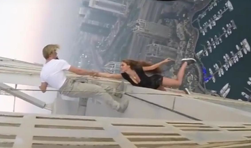 Dubai police summon Russian model who dangled from skyscraper-newspaper