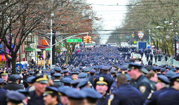 Thousands gather to mourn slain New York police officer