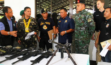 Peace commitment: Philippines' MILF group returns 16 guns of slain cops