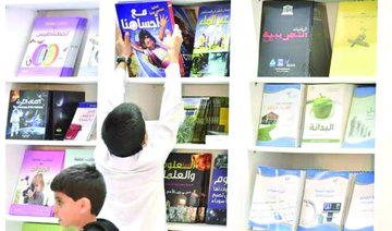 Volunteers guide children at Riyadh Book Fair