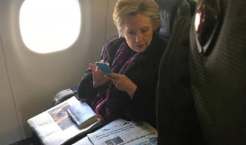 Snap of Clinton reading Pence e-mail headline goes viral