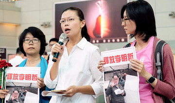 China bars wife of detained Taiwanese activist from visiting