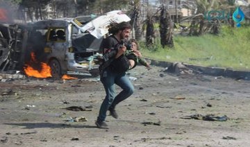 Syrian photographer praised for saving child after convoy bombing