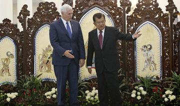 Pence praises moderate Islam in Indonesia in bid to heal divisions