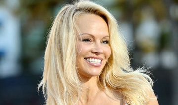 Pamela Anderson, Lady Gaga rally to cause of Julian Assange