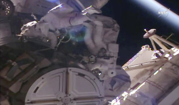 Spacewalking astronauts pull off urgent station repairs