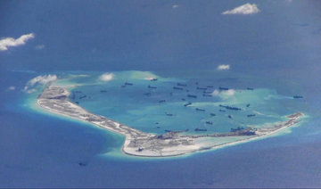 US Navy ship sails near South China Sea reef claimed by Beijing: US official