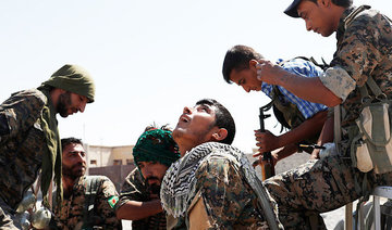 Spirits high among Kurds as coalition battles for Raqqa